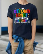 2nd Grade Done 3rd Grade Here We Come T-Shirt - model wearing navy shirt, hands in pockets