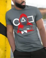 Red Guard Squid Game Inspired T-Shirt - model in grey shirt leaning against column