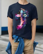 Vibrant Smoke Cross T-Shirt Spiritual Art Tee - model wearing navy shirt, hands in pockets