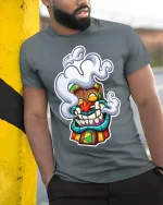Smoking Tiki Mask Tee Unique Graphic T-Shirt - model in grey shirt leaning against column
