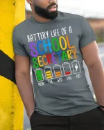 Battery Life of a School Secretary T-Shirt - model leaning on yellow-black pole, wearing Gray T-shirt, hand in pocket