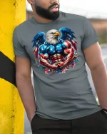 Patriotic Muscular Bald Eagle Tee - model leaning on yellow-black pole, wearing Gray T-shirt, hand in pocket