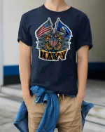 Proud U.S. Navy Crest and Flags Tee - model wearing Navy T-shirt, hands in pockets, denim shirt at waist