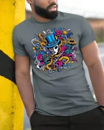 Masked Magician Chaos Art Tee - model leaning on yellow-black pole, wearing Gray T-shirt, hand in pocket