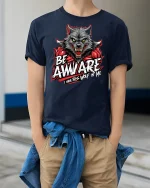 Be Awware Wolf Graphic Tee - model wearing Navy T-shirt, hands in pockets, denim shirt at waist
