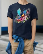Colorful Songbird and Floral Music Tee - model wearing Navy T-shirt, hands in pockets, denim shirt at waist
