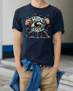 Hide and Seek Eye Tee - model wearing Navy T-shirt, hands in pockets, denim shirt at waist