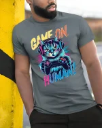 Funny Gamer Cat Tee - model leaning on yellow-black pole, wearing Gray T-shirt, hand in pocket