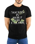 Success Built on Failure Money Quote T-shirt - model with hands behind back, wearing Black T-shirt and blue jeans