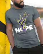 Futuristic Hope Hand Tee - model leaning on yellow-black pole, wearing Gray T-shirt, hand in pocket