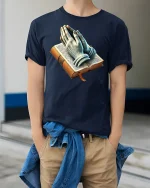 Faithful Prayer Hands Bible Graphic Tee - model wearing Navy T-shirt, hands in pockets, denim shirt at waist