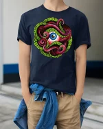 Octopus Eye T-shirt - model wearing Navy T-shirt, hands in pockets, denim shirt at waist