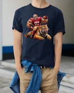 Fierce Football Player and Tiger Tee - model wearing Navy T-shirt, hands in pockets, denim shirt at waist