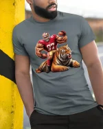 Fierce Football Player and Tiger Tee - model leaning on yellow-black pole, wearing Gray T-shirt, hand in pocket
