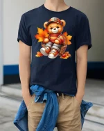 Cute Autumn Teddy Bear Cozy Fall Leaves T-Shirt - model wearing navy tee with hands in pockets