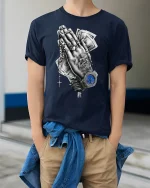 Praying Hands Money Watch T-Shirt - model wearing Navy T-shirt, hands in pockets, denim shirt at waist