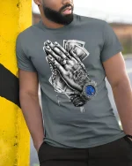 Praying Hands Money Watch T-Shirt - model leaning on yellow-black pole, wearing Gray T-shirt, hand in pocket