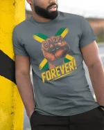 Gaza Forever Power Fist T-Shirt - model leaning on yellow-black pole, wearing Gray T-shirt, hand in pocket