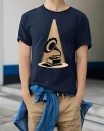 Vintage Gramophone Spotlight Graphic T-Shirt Retro Art - model wearing Navy T-shirt, hands in pockets, denim shirt at waist