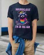 Sounds Gay I’m In The Bin Raccoon Pride T-Shirt - model wearing Navy T-shirt, hands in pockets, denim shirt at waist