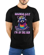 Sounds Gay I’m In The Bin Raccoon Pride T-Shirt - model with hands behind back, wearing Black T-shirt and blue jeans