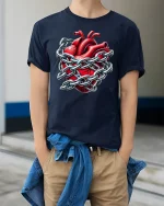 Heart in Chains T-Shirt - Locked Love Gothic Tee - model wearing navy tee with hands in pockets