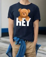 Hey Teddy Bear T-Shirt - Cute Smiling Bear Graphic Tee - model wearing navy tee with hands in pockets