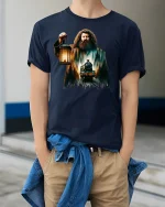 Fantasy Forest Train Keeper Lantern Magic T-Shirt - model wearing navy tee with hands in pockets