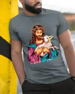 Jesus Holding Lamb Graphic T-Shirt Christian Inspirational Tee - model wearing grey tee, leaning on column