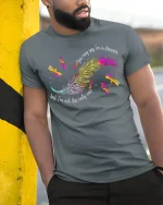 Colorful Feather Dragonfly Graphic T-Shirt Artistic Nature Tee - model wearing grey tee, leaning on column