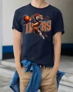 Tiger Basketball Dunk Mascot Action Sports Graphic T-Shirt - model wearing navy tee with hands in pockets