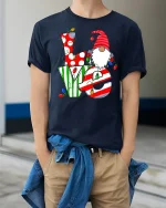 Christmas Love Gnome Cute Holiday Lights Graphic T-Shirt - model wearing navy tee with hands in pockets
