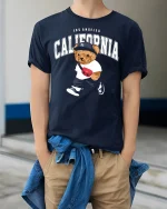 California Bear Street Style Tee for Trendy LA Fashion Lovers - model wearing navy tee with hands in pockets