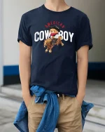 Cute American Cowboy Bear Tee Riding Horse in Fun Western Style - model wearing navy tee with hands in pockets
