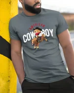 Cute American Cowboy Bear Tee Riding Horse in Fun Western Style - model wearing grey tee, leaning on column