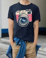 Vintage Camera Lens Tee Retro Photography Lover Tshirt - model wearing navy tee with hands in pockets