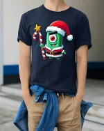 Cute Cyclops Santa Tee Funny One Eyed Christmas Creature Tshirt - model wearing navy tee with hands in pockets