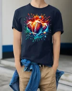Vibrant Football Splash Art Tee for Sports Lovers - model wearing navy tee with hands in pockets