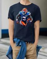 Electric Football Player Tee for Game Day Energy - model wearing navy tee with hands in pockets