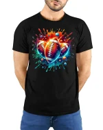 Vibrant Football Splash Art Tee for Sports Lovers - model wearing black tee with hands behind back