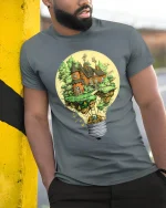 Fantasy Lightbulb House Tee Creative Floating Cottage Tshirt - model wearing grey tee, leaning on column