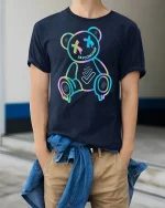 Neon Drip Bear Tee Glow Outline Trendy Street Art Graphic Tshirt - model wearing navy tee with hands in pockets