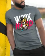 Work Hard Bear Graphic Tee for Hustle Lovers - model wearing grey tee, leaning on column