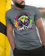 Game Over Headphones T-Shirt - model wearing grey tee, leaning on column