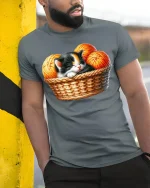 Cute Sleeping Kitten Basket Graphic Tee for Cat Fans - model wearing grey tee, leaning on column
