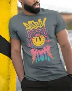 Trippy Smiley Face Lightning Graphic Tee for Vibes - model wearing grey tee, leaning on column