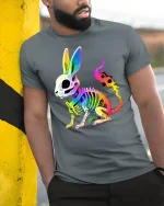 Neon Skeleton Bunny Graphic Tee for Bold Style - model wearing grey tee, leaning on column