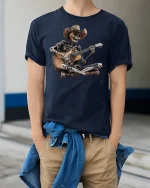 Cowboy Skeleton Guitar Jam Funny Graphic T-Shirt - model wearing navy tee with hands in pockets