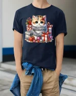 Cute Christmas Kitten With Gift Boxes Graphic T Shirt Cozy Tee - model wearing navy tee with hands in pockets
