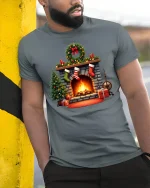 Cozy Christmas Fireplace Graphic T Shirt Holiday Home Warm Vibes Tee - model wearing grey tee, leaning on column